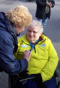 Municipal Clerk/Administrator Debbie Tonelli Admires the Medal